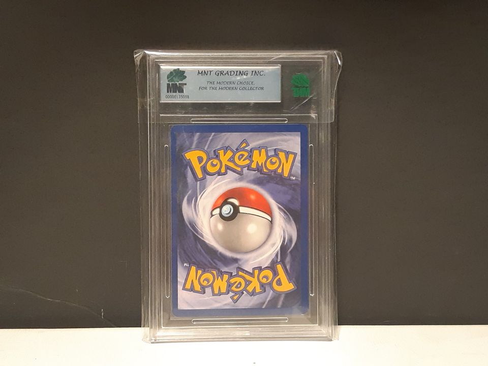 1st Edition Jungle Venonat Graded 8